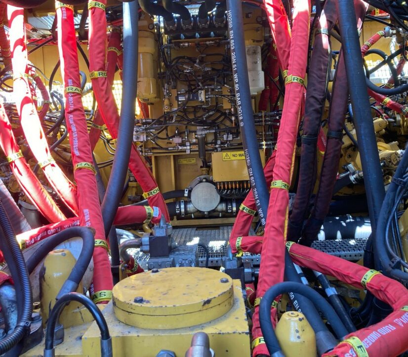 Customised Hydraulic Hose Burst Sleeving protecting Maintainers