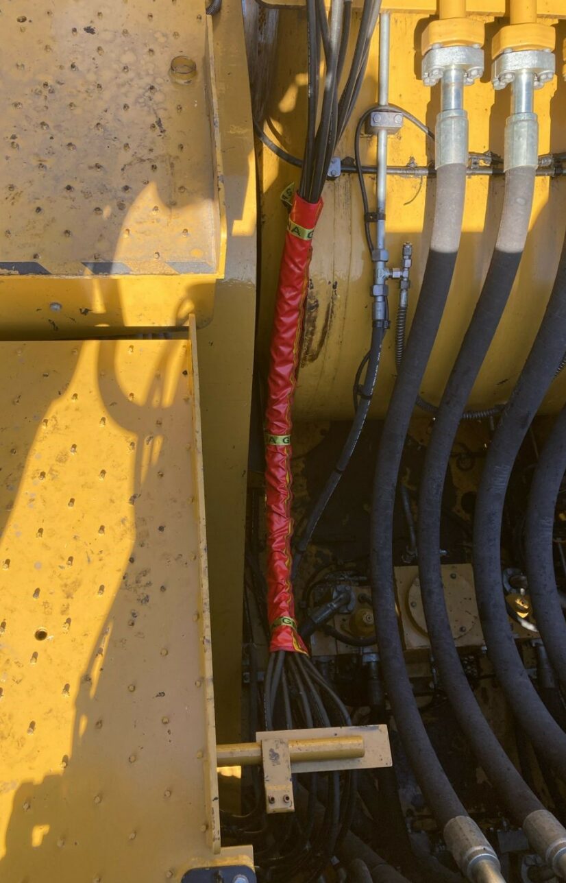 Customised Hydraulic Hose Burst Sleeving protecting Maintainers